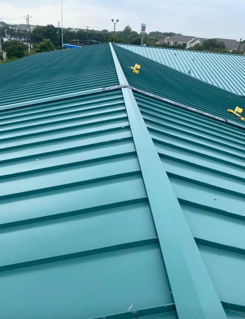 Green commercial metal roof ridge and valley for Metal Roof Repair in Auburn